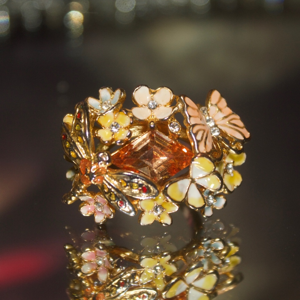 Beautiful and intricate butterfly topaz ring